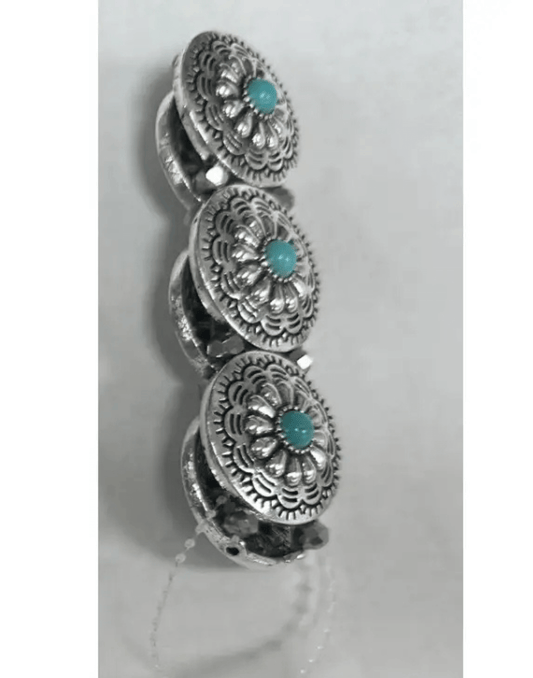 Prairie Blossom Cuff featuring three silver concho-style discs with engraved floral details and turquoise center stones.