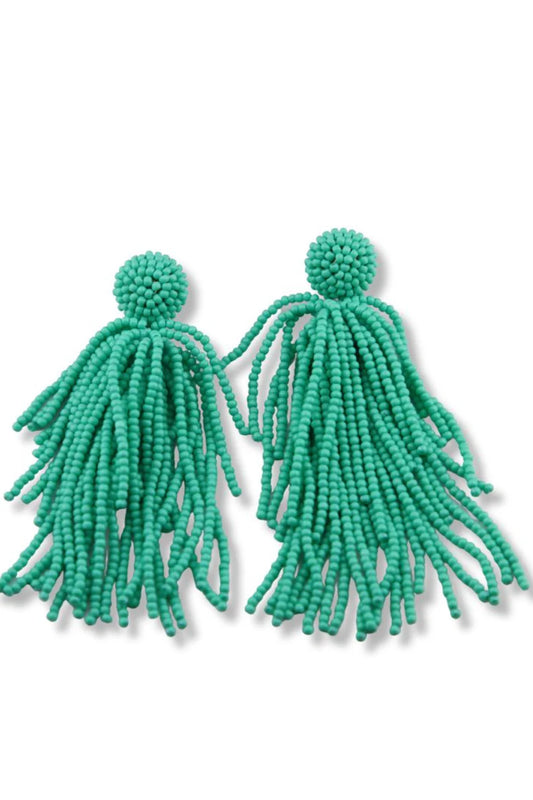 Pair of vibrant turquoise beaded tassel earrings with round beaded tops and flowing fringe strands, displayed on a white background.