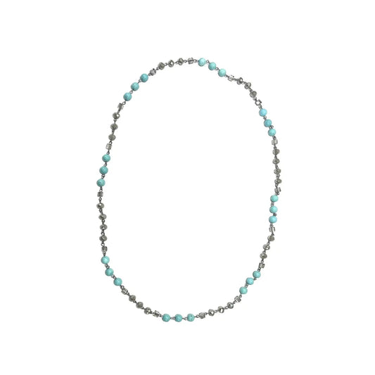 Silver Sky Strand — a delicate necklace featuring alternating turquoise beads and faceted silver crystals — displayed in a looped shape against a plain white background.
